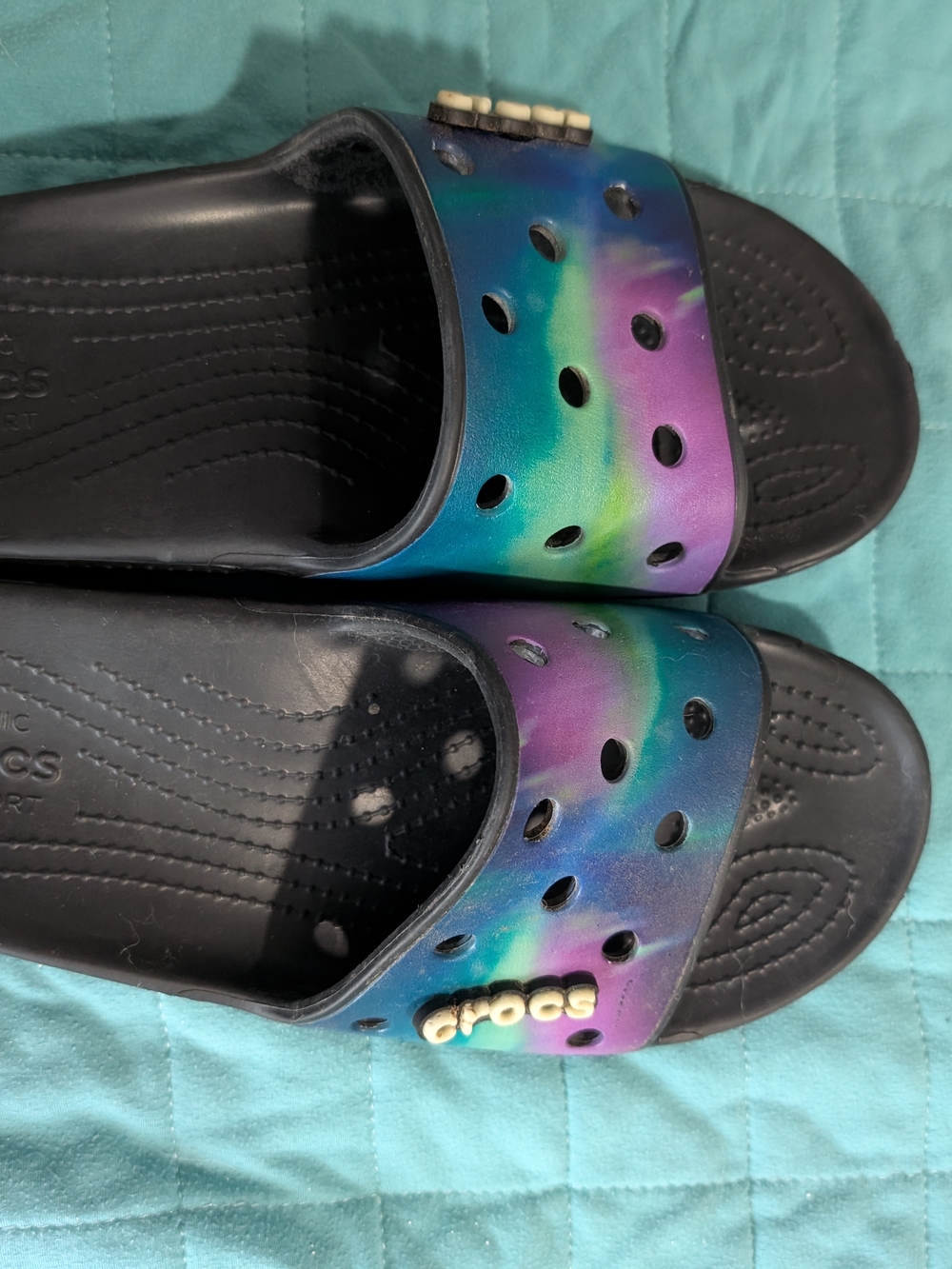 Crocs Slide Sandals in Iridescent Rainbow